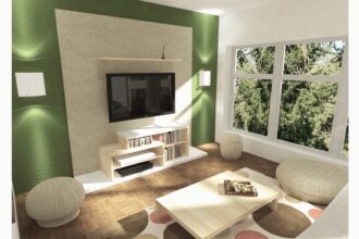 Living room with a green feature wall, wall-mounted TV and orange sofa.