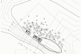 Site plan with dense contour lines, trees and the house placed above the lake shore.