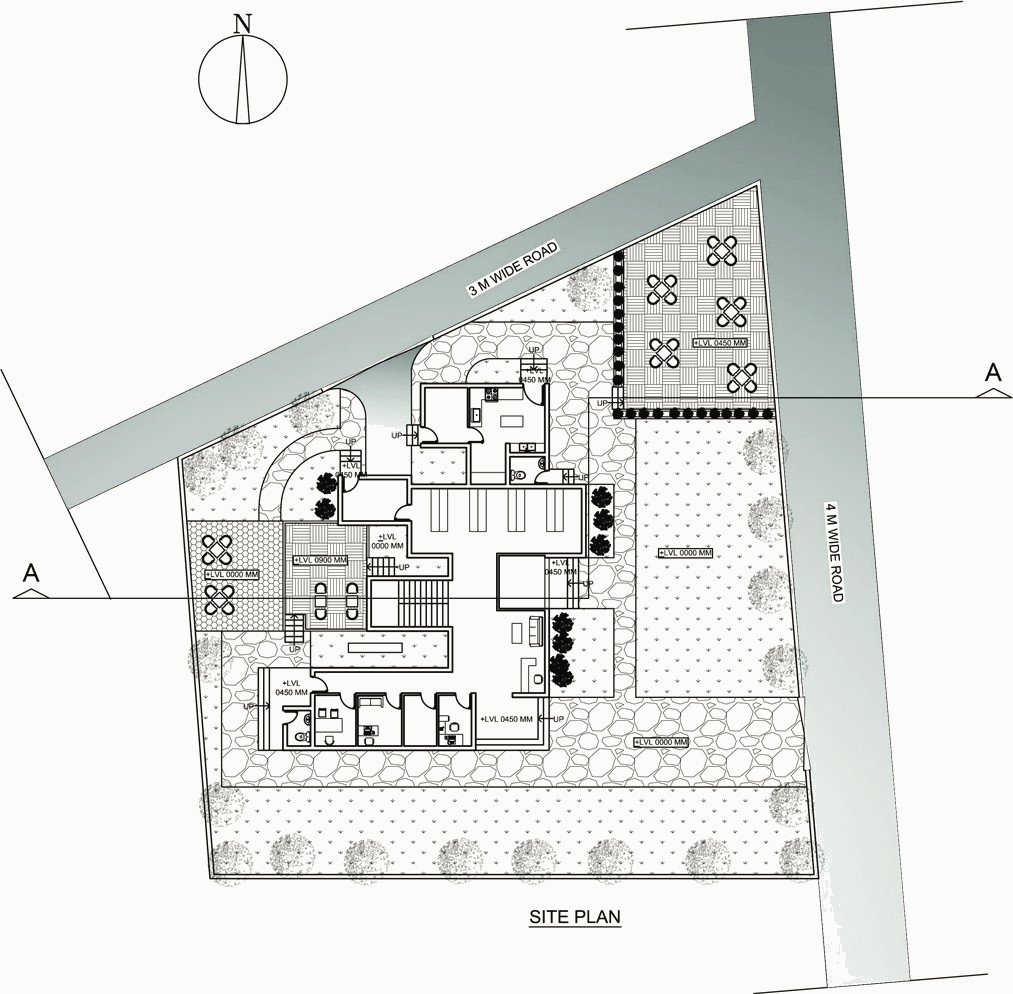 Site plan on a triangular plot between roads.