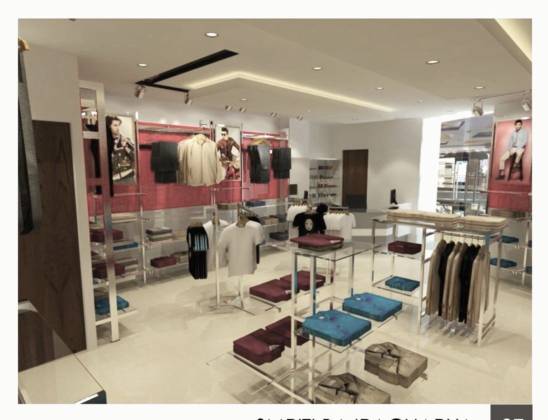Retail interior with red display walls and clothing racks.