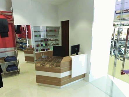 John Players showroom render: white cash counter and display shelving by the entrance.