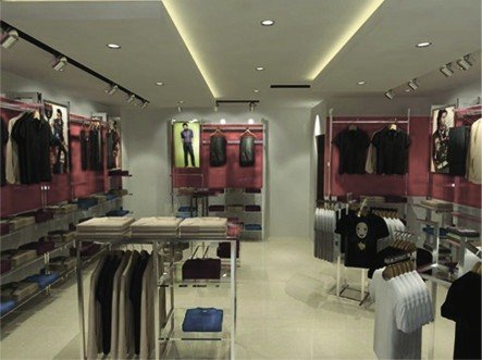 John Players showroom render: central display tables and wall shelving with red brand accents.