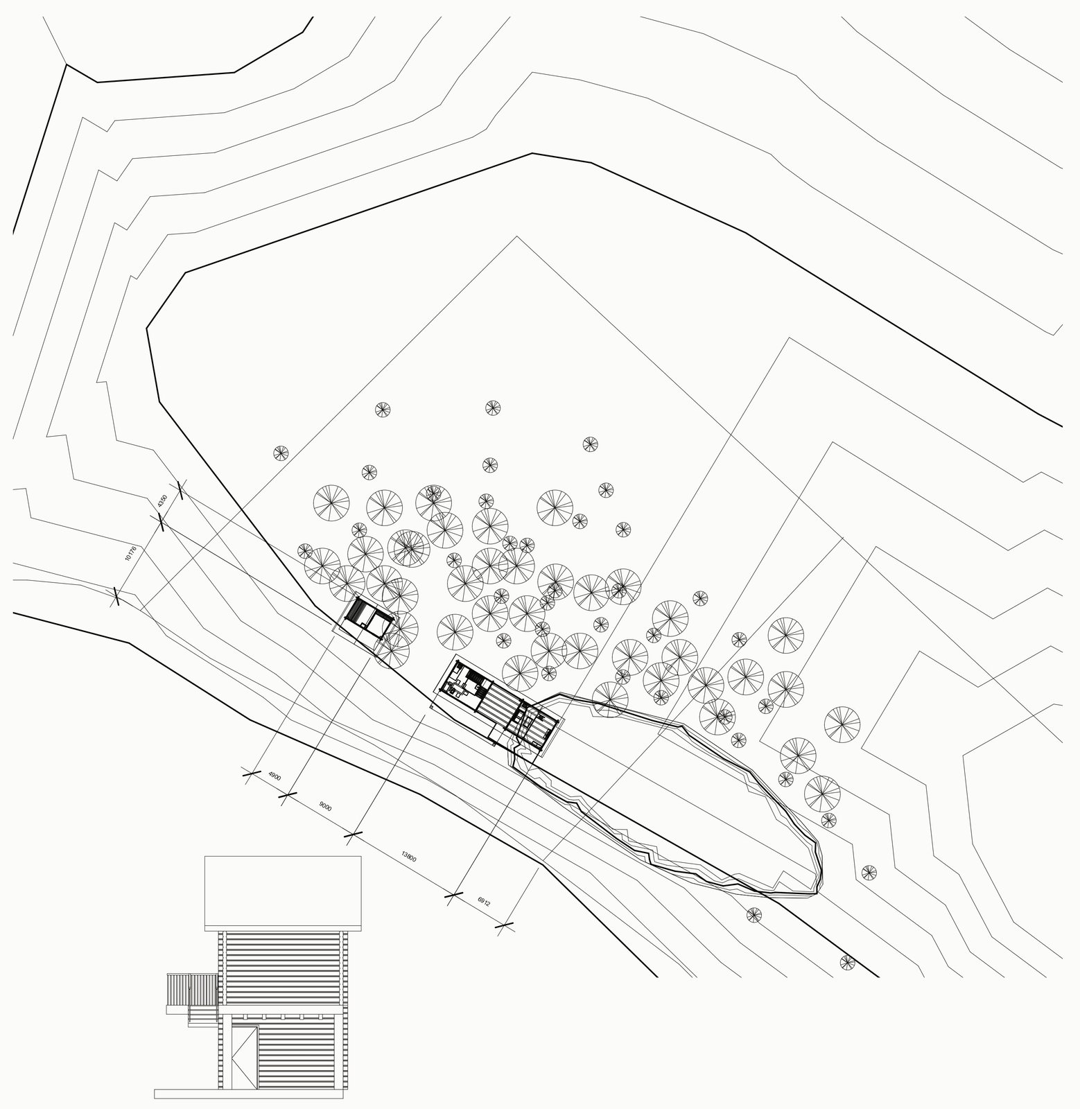 Site plan with dense contour lines, trees and the house placed above the lake shore.
